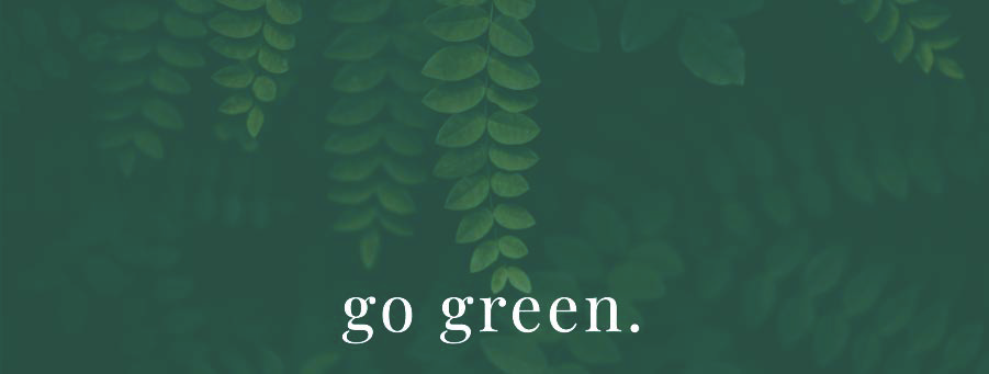 Green plant background with the words go green