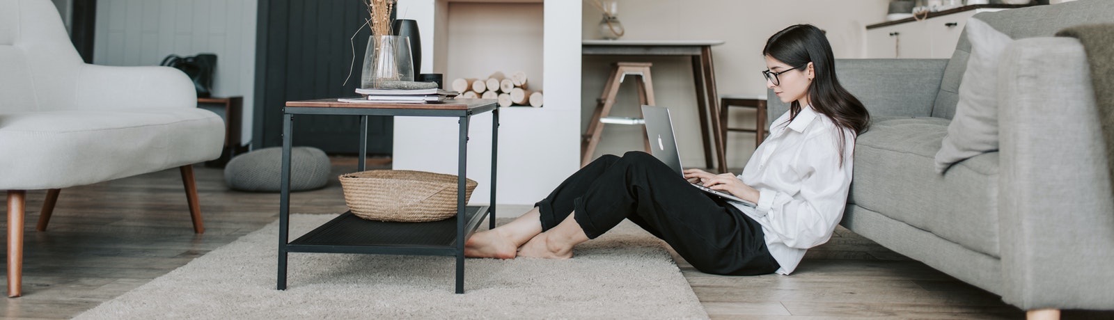 woman on floor working on laptop