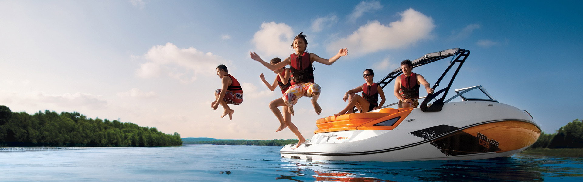 Image of kids jumping out of a boat