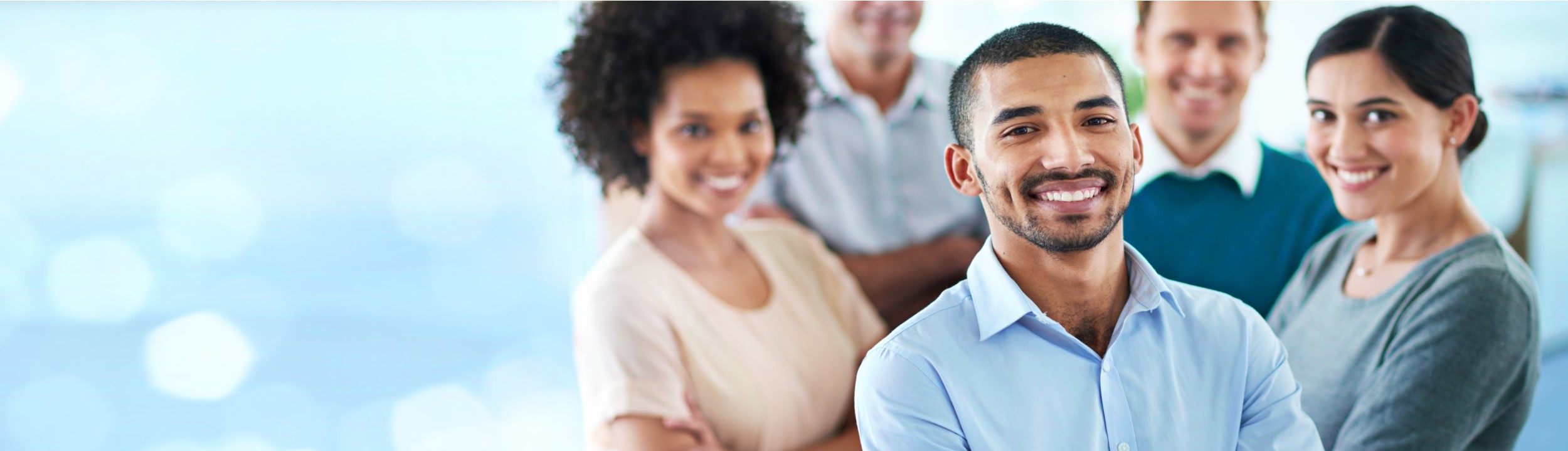 Image of a group of male and females smiling