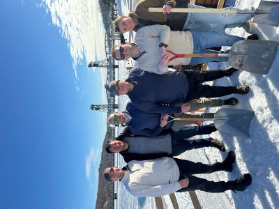 A group of employees in Stillwater gathering snow for sculpting competition