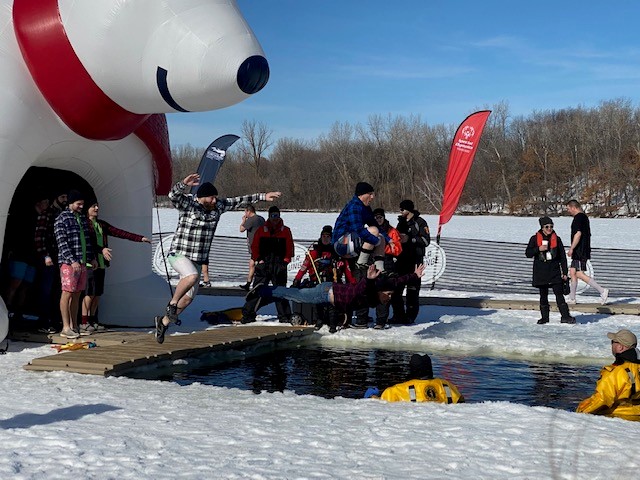 Picture of the Polar Plunge LEB employees jumping in water